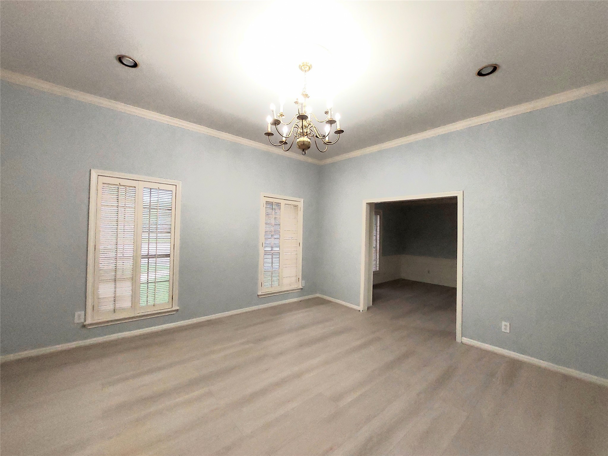 7815 Small Leaf Circle Houston, TX 77063 - Photo 12 of 28 Family room seamlessly leads to the formal dinning room