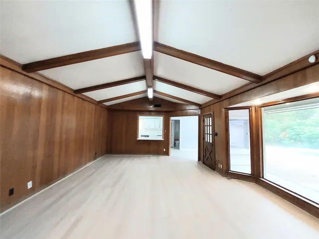 a view of a room with a large window