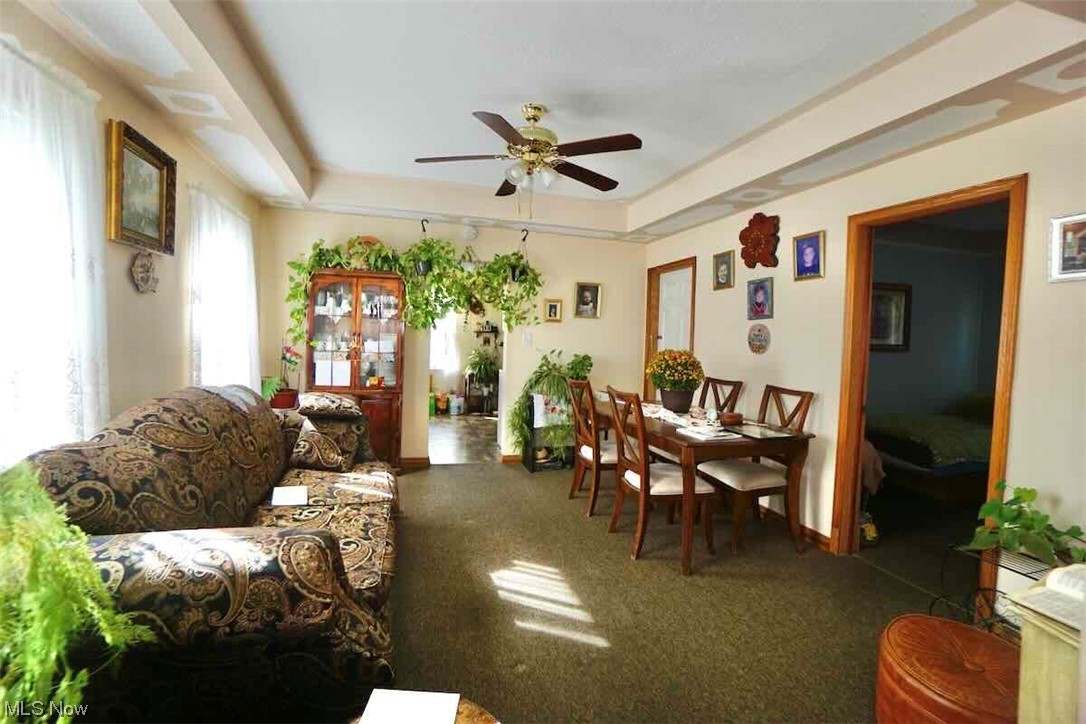 3756 Bosworth Road Cleveland, OH 44111 - Photo 5 of 23 Living room featuring a tray ceiling and ceiling fan