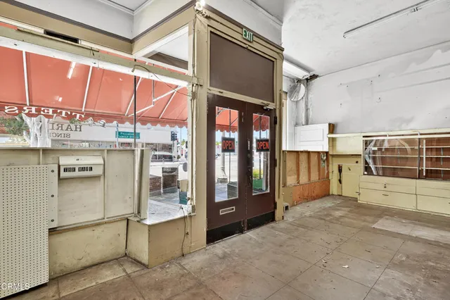 a view of an entryway with a kitchen