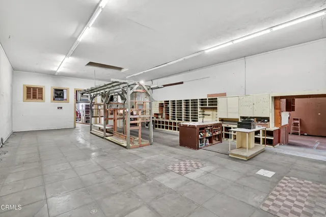 a view of a livingroom with furniture and white walls