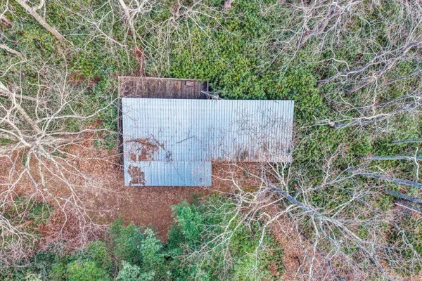 an outdoor space with wooden fence
