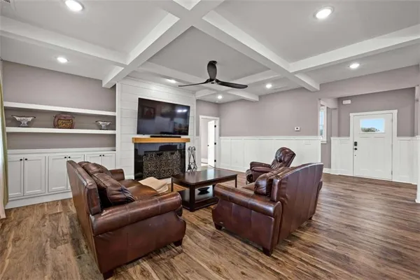 a kitchen with granite countertop white cabinets and stainless steel appliances