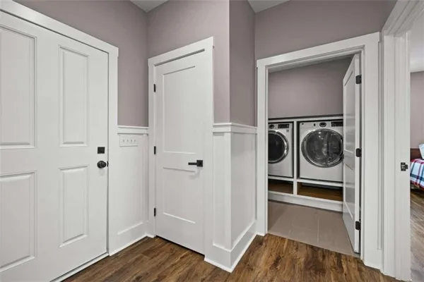 a bathroom with a granite countertop sink a toilet a mirror and shower