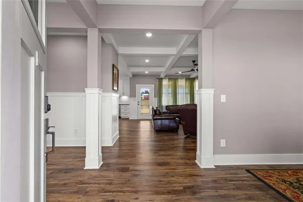 a view of a dining room with furniture and wooden floor