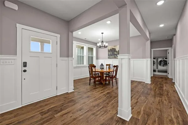 a kitchen with stainless steel appliances granite countertop a sink and a refrigerator