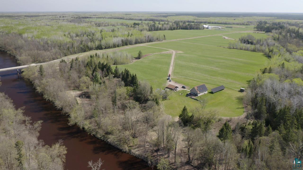 10362 Arkola Road Meadowlands, MN 55765 - Photo 1 of 30 Aerial view of property and surrounding area with rural landscape, a large body of water, and a pastoral area