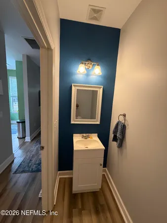 a room with a door and wooden floor