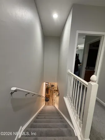a view of a hallway to a bedroom