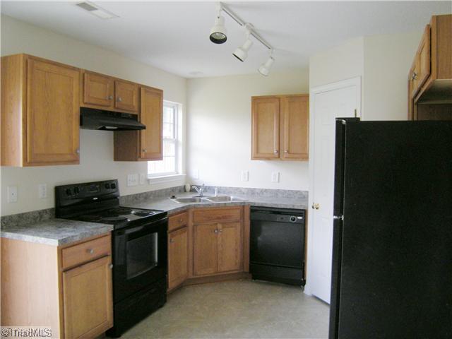 4704 Fewell Road Greensboro, NC 27405 - Photo 3 of 12 Kitchen. Kitchen with good cabinet space & pantry