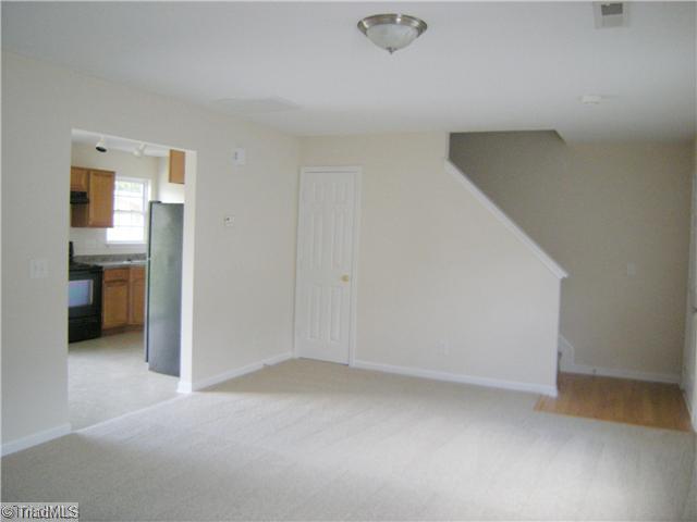 4704 Fewell Road Greensboro, NC 27405 - Photo 6 of 12 Living Room. Another living room view showing staircase