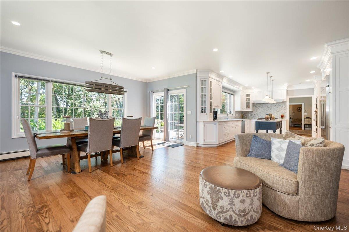 155 Jennings Road Cold Spring Harbor, NY 11724 - Photo 36 of 36 Open floor plan, crown molding, light wood-style floors, and recessed lighting