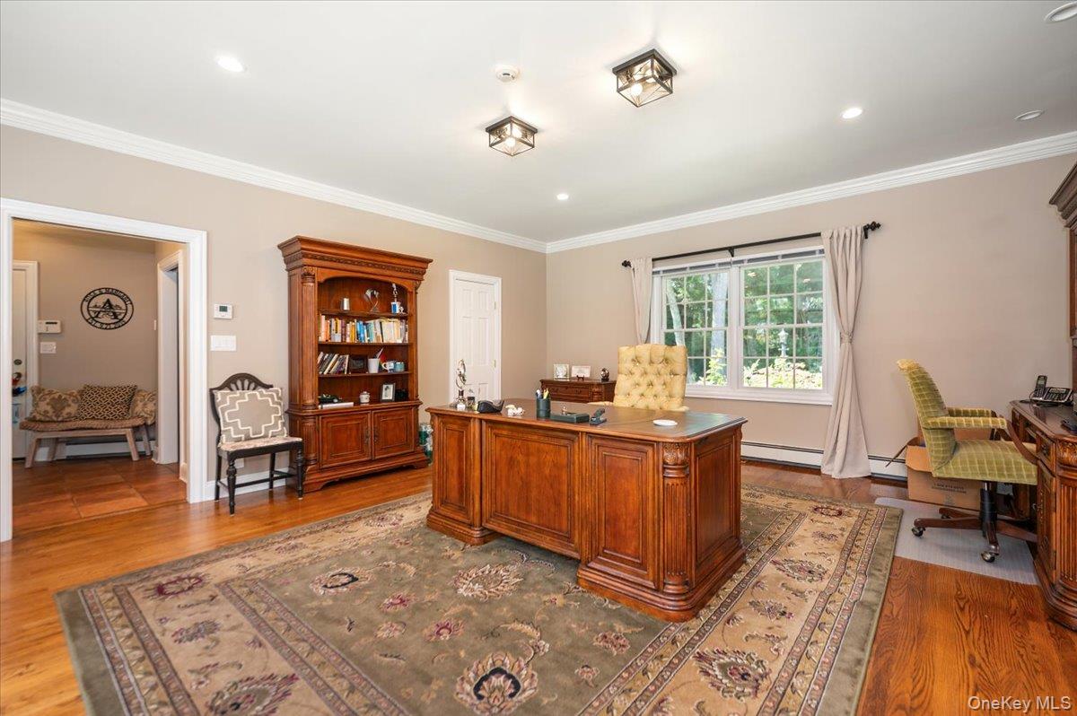 155 Jennings Road Cold Spring Harbor, NY 11724 - Photo 17 of 36 Home office or 5th Bedroom featuring light wood-style flooring, ornamental molding, recessed lighting, and a baseboard radiator