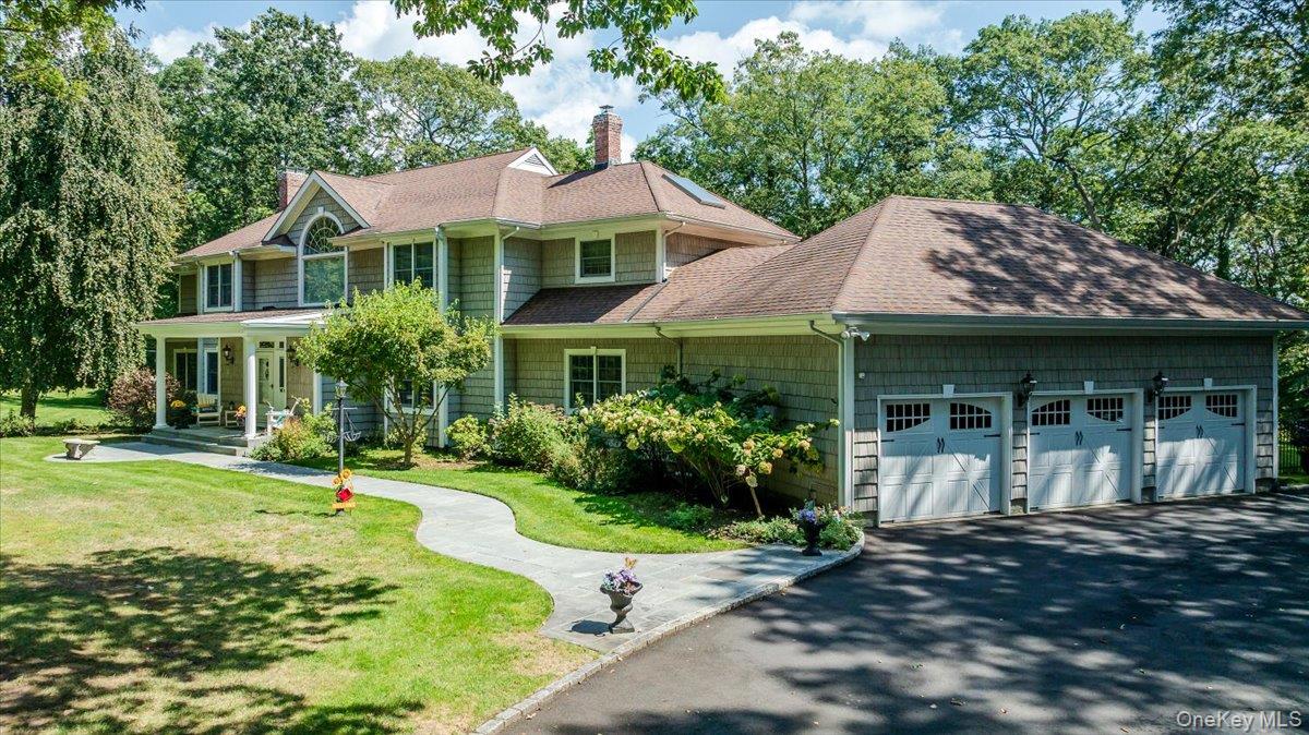 155 Jennings Road Cold Spring Harbor, NY 11724 - Photo 2 of 36 View of front of house with a front lawn, roof with shingles, a chimney, covered porch, and driveway