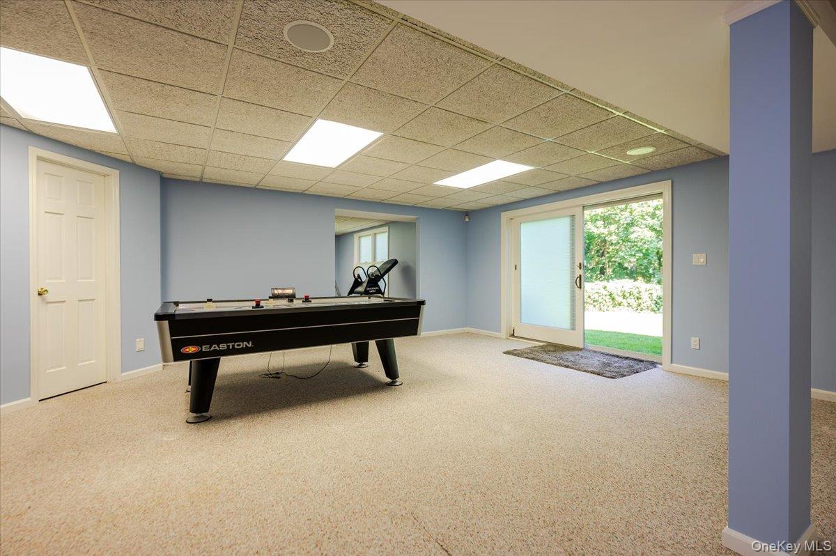 155 Jennings Road Cold Spring Harbor, NY 11724 - Photo 28 of 36 Game room featuring carpet floors and a paneled ceiling