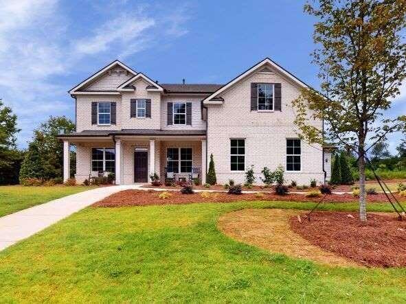 3838 Amicus Drive Buford, GA 30518 - Photo 1 of 1 a front view of a house with patio and yard