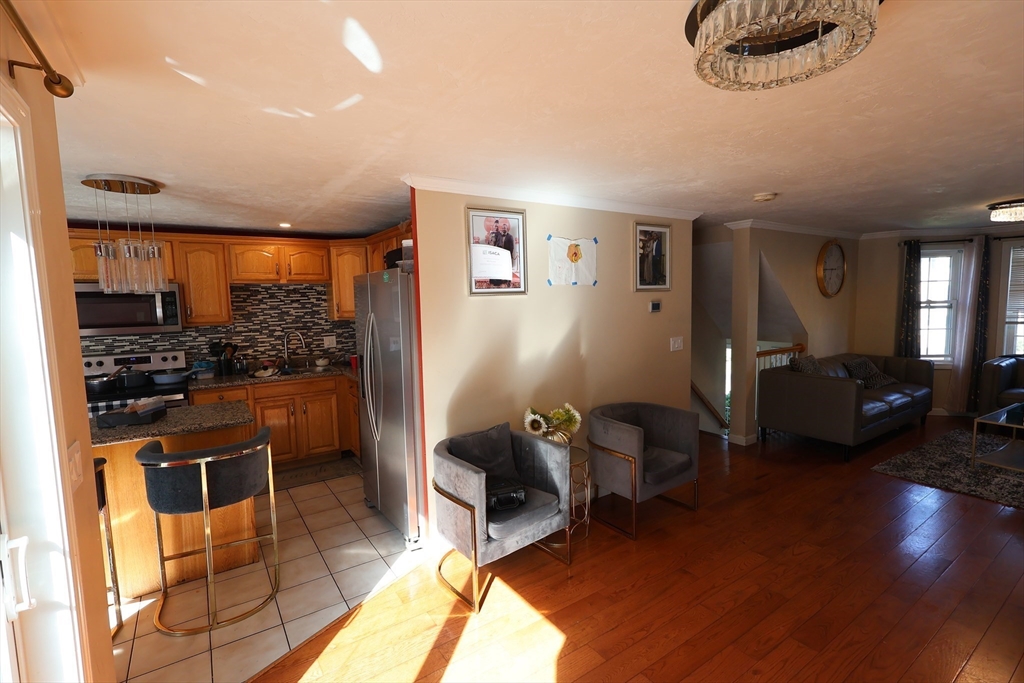74 Sophia Drive Worcester, MA 01607 - Photo 4 of 15 a room with furniture a rug and stainless steel appliances