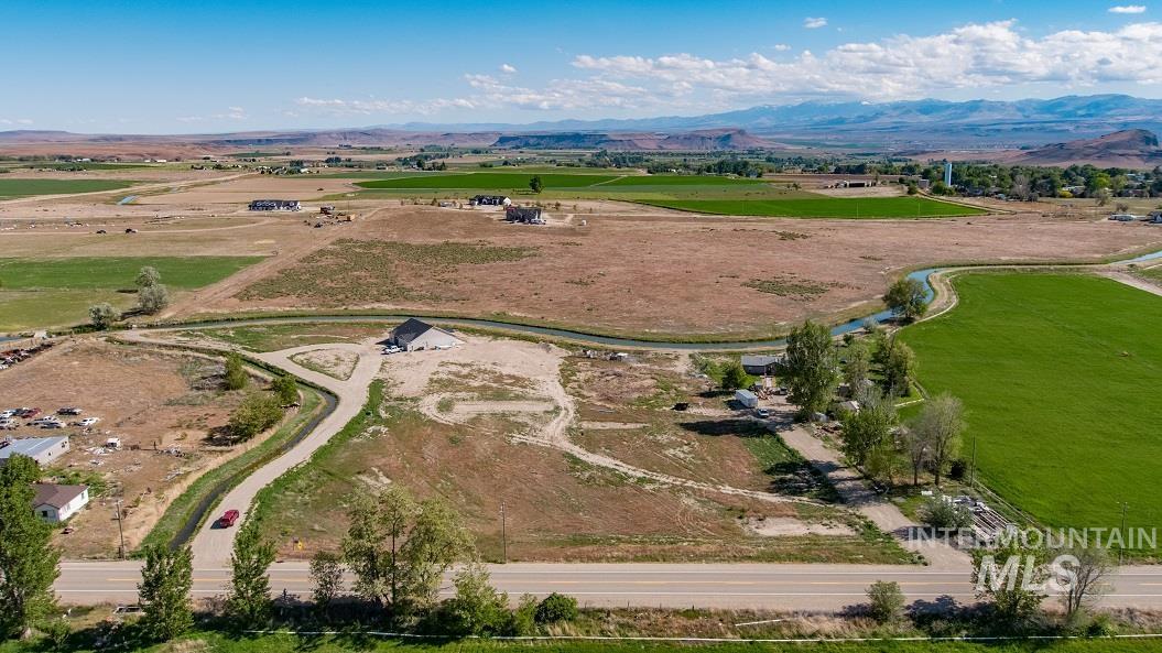 Cs Melba Road Melba, ID 83641 - Photo 5 of 12 Aerial view of sparsely populated area featuring a mountainous background