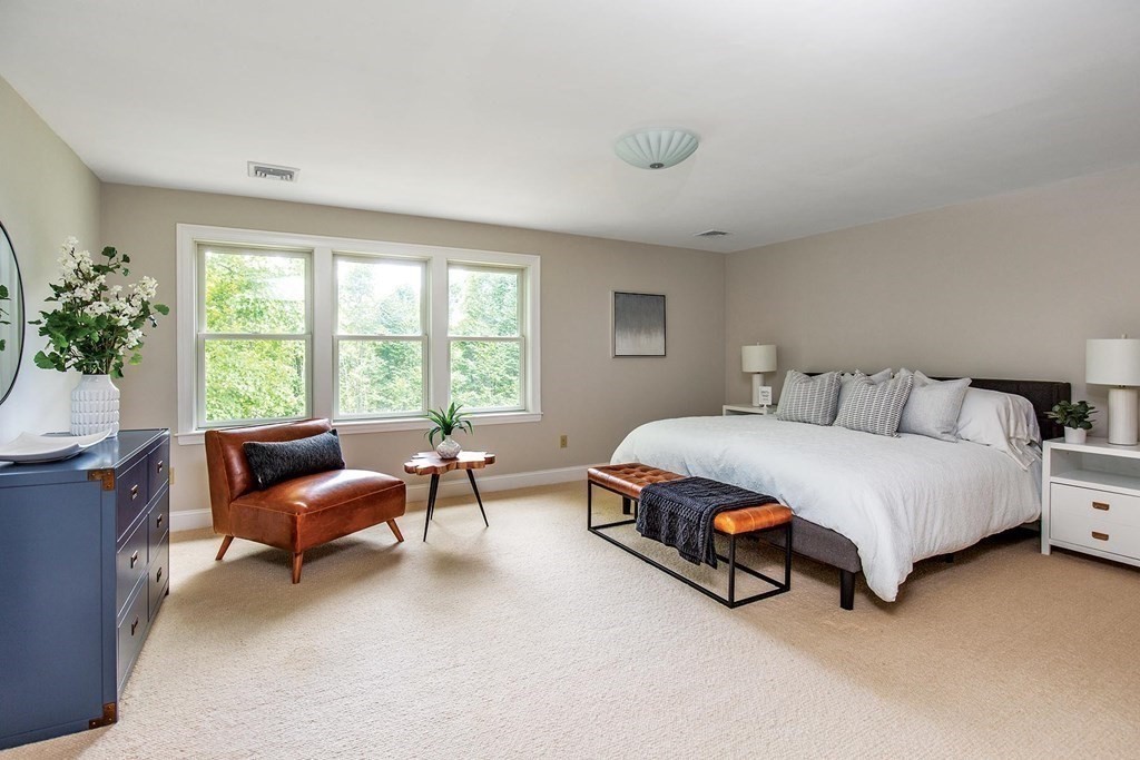 45 Haynes Road Newton, MA 02459 - Photo 8 of 12 a spacious bedroom with a bed chair and a window