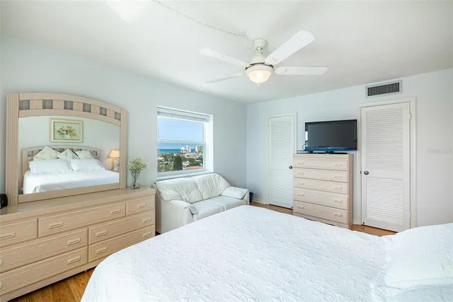 a bedroom with a bed and a dresser