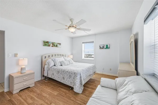 a living room with a bed furniture and a window