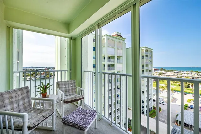 a balcony with furniture and city view