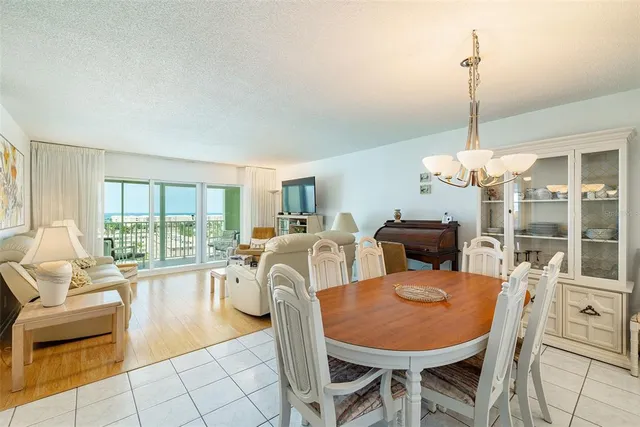 a living room with furniture a table and chairs