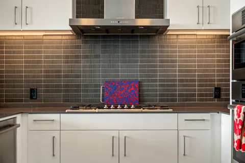 a kitchen with a sink a counter top space and a window