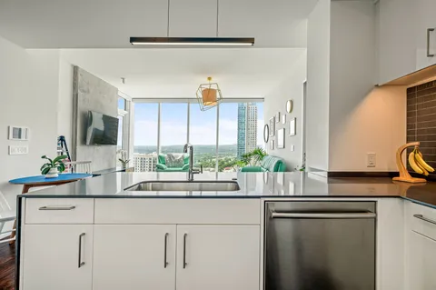a kitchen with a sink and cabinets