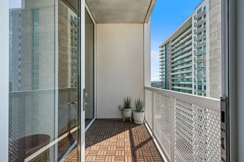 a view of balcony with furniture