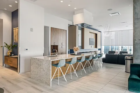 a lobby with furniture and floor to ceiling window