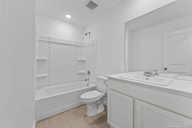 a view of a kitchen with a sink and cabinets