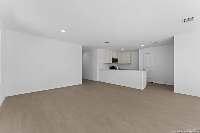 a kitchen with a sink and a stove top oven