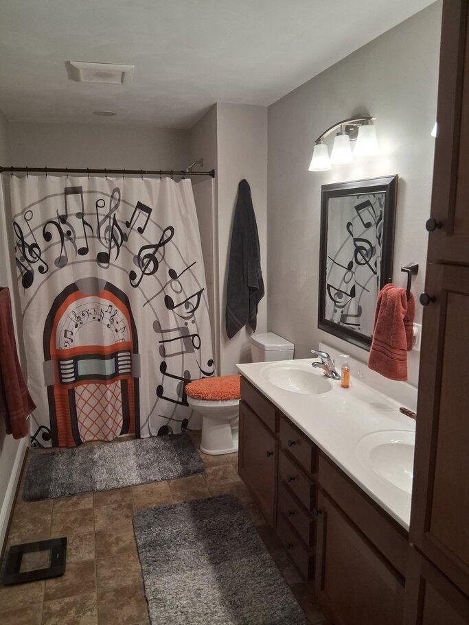 2348 East Ruritan Road Roanoke, VA 24012 - Photo 23 of 31 a bathroom with a double vanity sink mirror and toilet