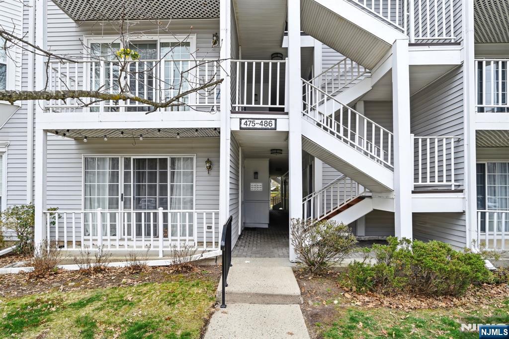 475 Quince Court Mahwah, NJ 07430 - Photo 2 of 27 a view of a house with a small yard and wooden floor and fence