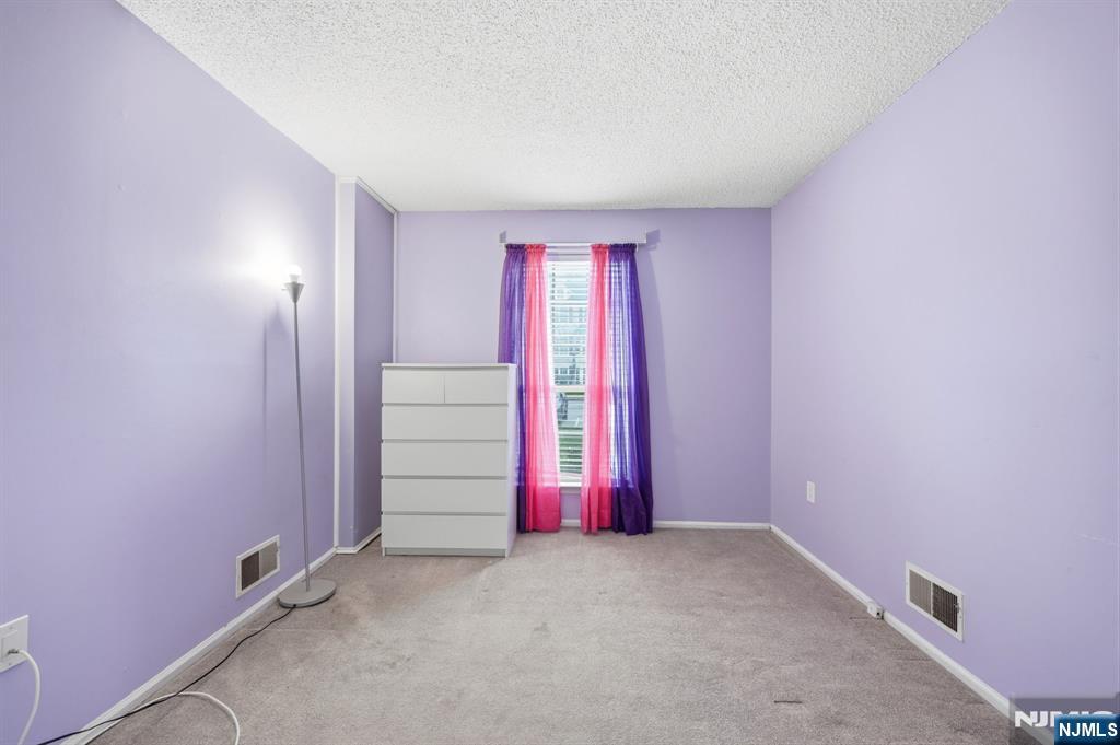 475 Quince Court Mahwah, NJ 07430 - Photo 22 of 27 an empty room with windows and closet