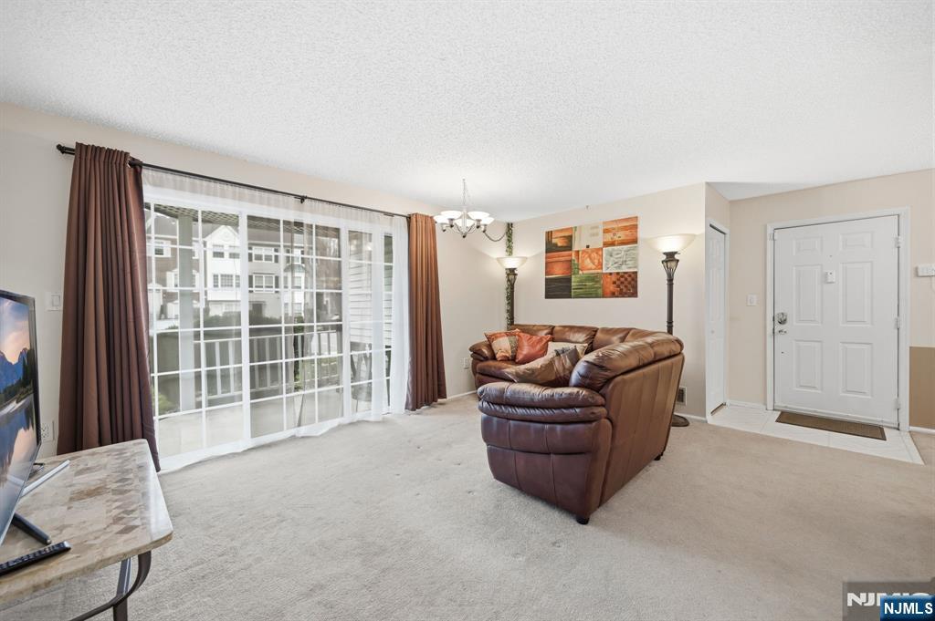 475 Quince Court Mahwah, NJ 07430 - Photo 7 of 27 a living room with furniture and a large window