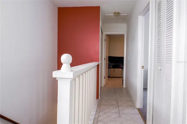 a bedroom with a bed and a flat tv screen