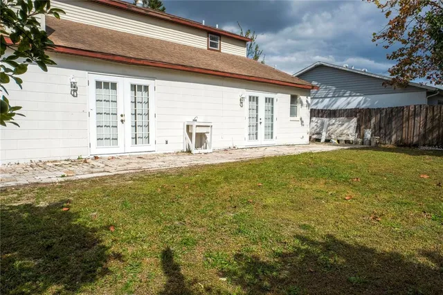 a swimming pool with wooden fence