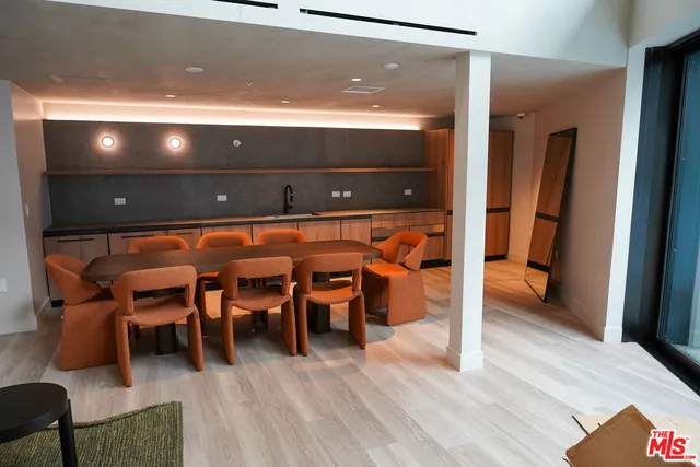 a view of dining room with furniture and wooden floor