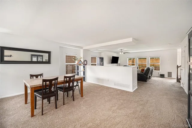 a view of a livingroom with furniture and white walls