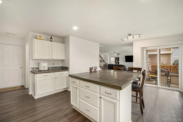 a kitchen with stainless steel appliances granite countertop a sink and cabinets