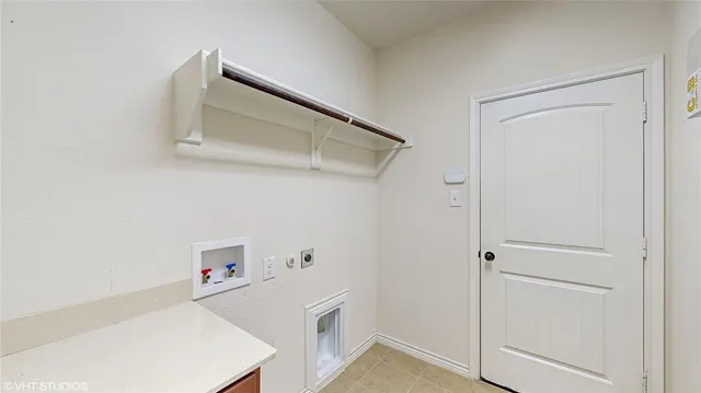 an empty room with windows and ceiling fan