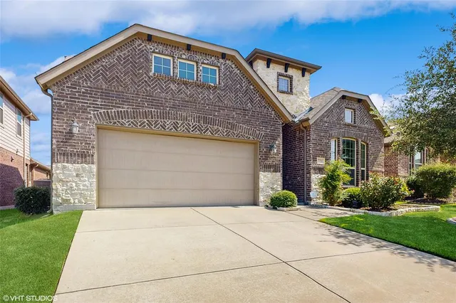 a view of a room with wooden floor and windows