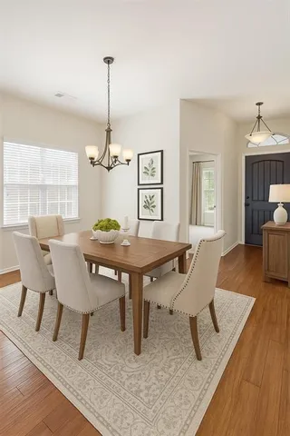a view of a livingroom with furniture window and wooden floor