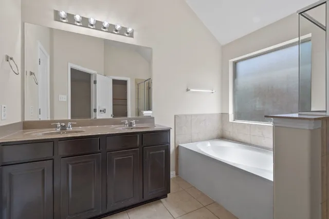 a bathroom with a glass shower door