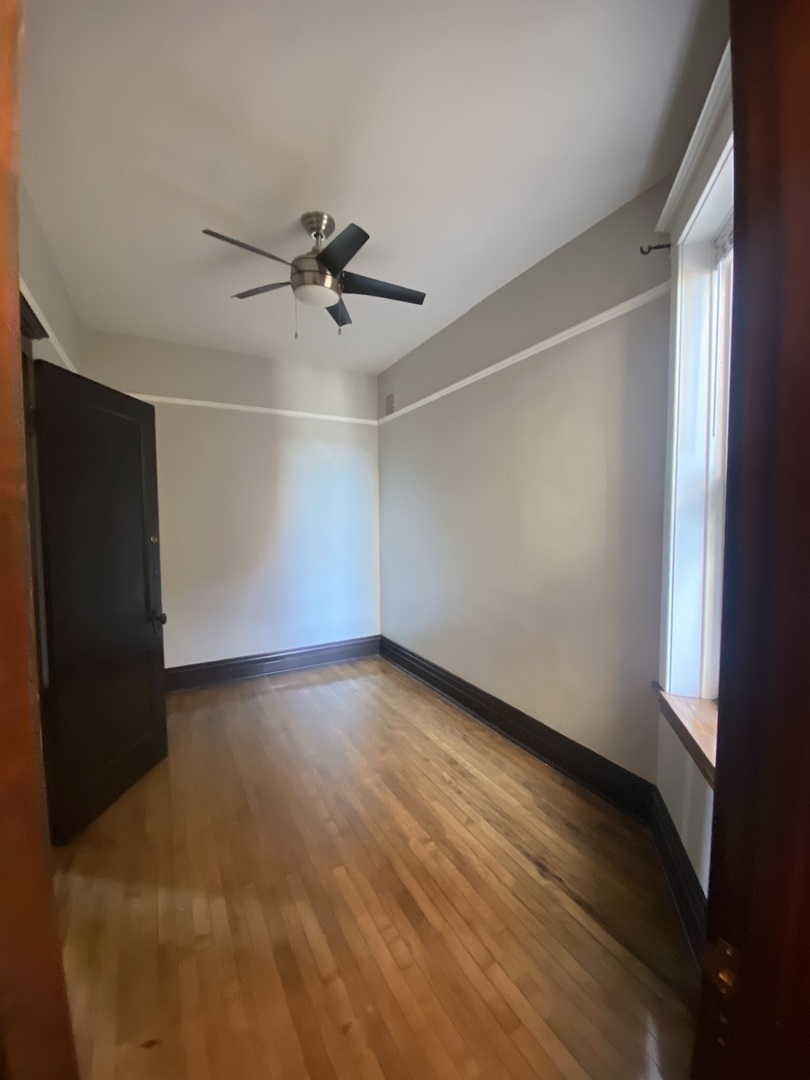 2898 North Milwaukee Avenue, Unit 2 Chicago, IL 60618 - Photo 8 of 10 a view of an empty room with a window