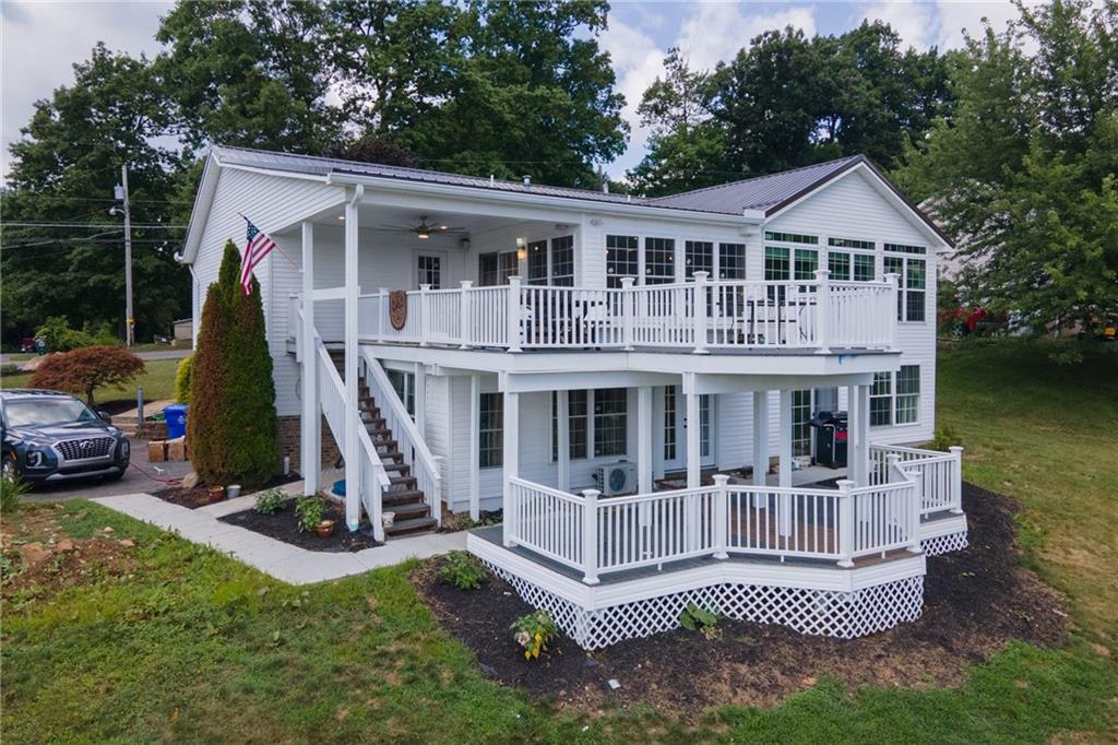 601 Slippery Rock Road Slippery Rock, PA 16057 - Photo 2 of 25 a view of a house with a roof deck