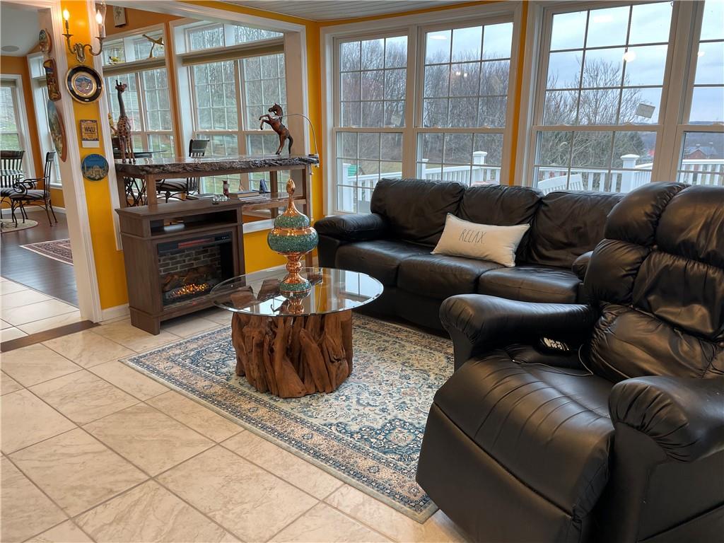 601 Slippery Rock Road Slippery Rock, PA 16057 - Photo 8 of 25 a living room with furniture and a floor to ceiling window
