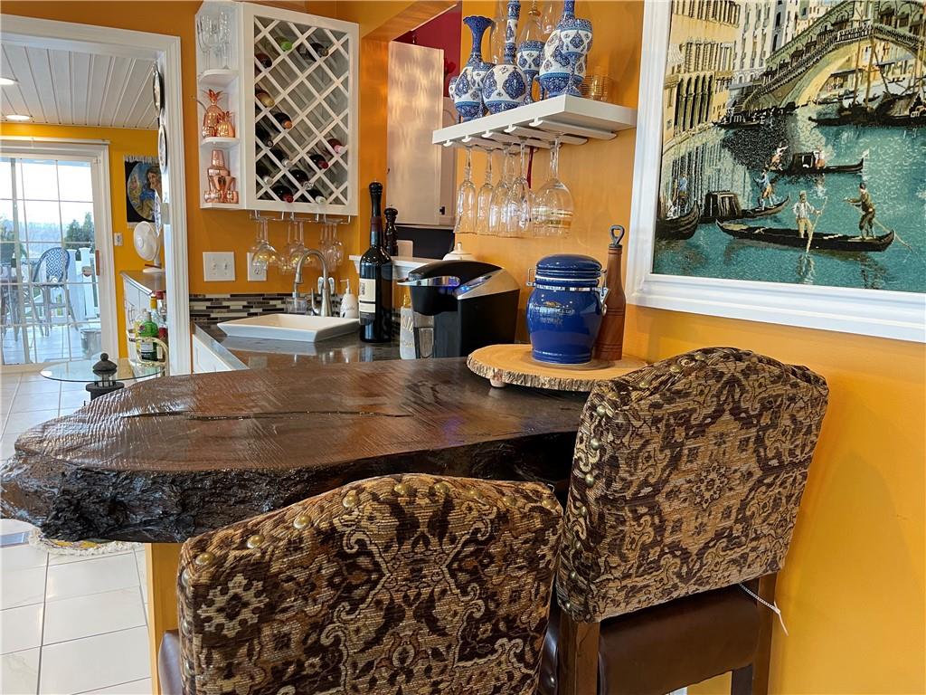 601 Slippery Rock Road Slippery Rock, PA 16057 - Photo 10 of 25 a view of a chairs and table in the patio